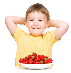 Image showing Little boy with strawberries