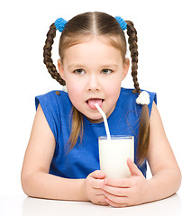 Image showing Cute little girl with a glass of milk