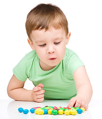 Image showing Portrait of a boy with candies