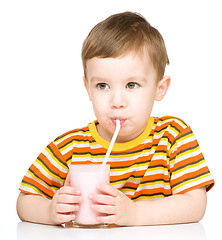 Image showing Cute little boy with a glass of milk