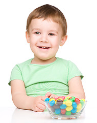 Image showing Portrait of a boy with candies