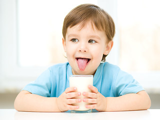 Image showing Cute little boy with a glass of milk