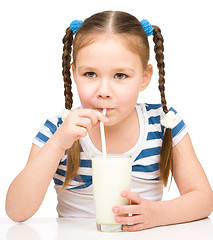 Image showing Cute little girl with a glass of milk