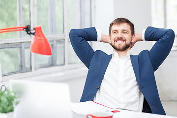 Image showing The male office worker resting