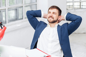 Image showing The male office worker resting