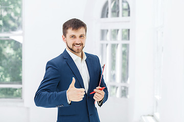 Image showing The smiling male office worker