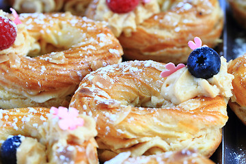 Image showing cream puff with raspberries and blueberries