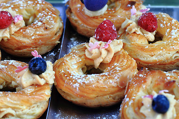 Image showing cream puff with raspberries and blueberries