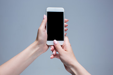 Image showing Closeup shot of a woman typing on mobile phone 