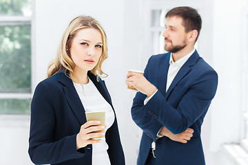 Image showing Young colleagues having coffee break in office