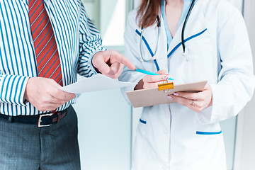 Image showing Close-up of doctor and patient hands