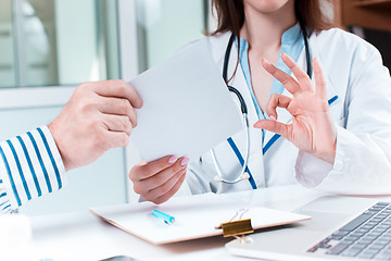 Image showing The patient and his doctor in medical office