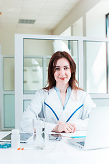 Image showing Woman doctor sitting at the table