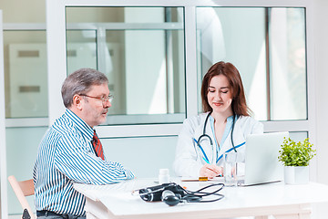 Image showing The patient and his doctor in medical office