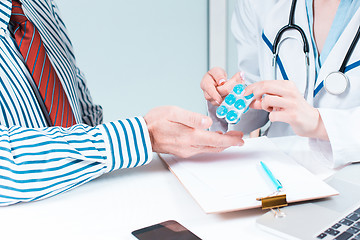 Image showing The patient and his doctor in medical office