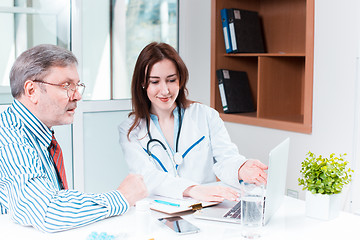 Image showing The patient and his doctor in medical office