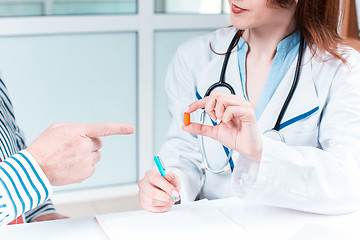 Image showing The patient and his doctor in medical office