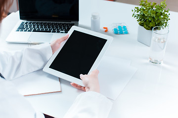 Image showing Doctor working on a digital tablet