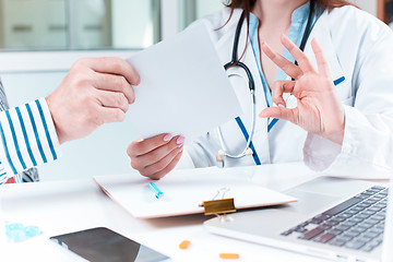 Image showing The patient and his doctor in medical office