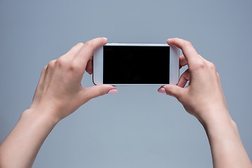 Image showing Closeup shot of a woman typing on mobile phone 