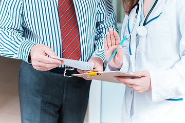 Image showing Close-up of doctor and patient hands