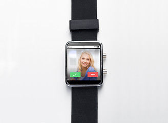 Image showing close up of black smart watch with incoming call