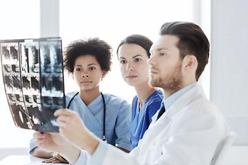 Image showing group of doctors looking to x-ray at hospital