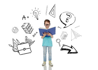 Image showing happy little girl in eyeglasses reading book