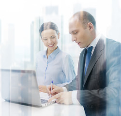 Image showing business team with laptop having discussion