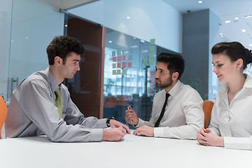 Image showing young couple signing contract documents on partners back