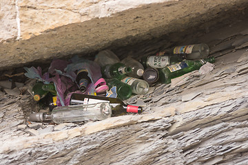 Image showing Anapa, Russia - March 9, 2016: A pile of empty bottles in the niche of the rock