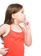 Image showing Little girl is showing hush gesture