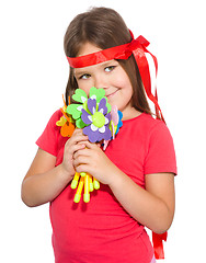 Image showing Cute little girl wit a bunch of flowers