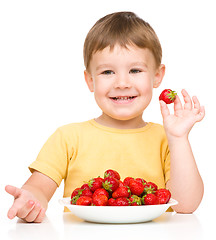 Image showing Little boy with strawberries