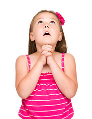 Image showing Cute little girl is praying