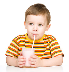 Image showing Cute little boy with a glass of milk