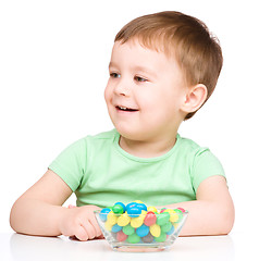 Image showing Portrait of a boy with candies