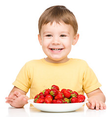 Image showing Little boy with strawberries