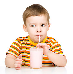 Image showing Cute little boy with a glass of milk