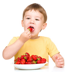 Image showing Little boy with strawberries