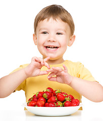 Image showing Little boy with strawberries