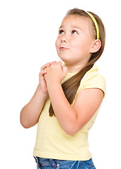 Image showing Cute little girl is praying