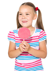 Image showing Little girl with lollipop