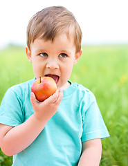 Image showing Portrait of a little boy with apple