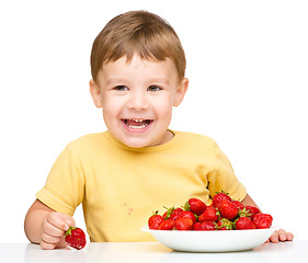 Image showing Little boy with strawberries