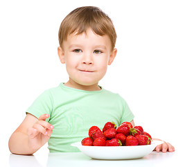 Image showing Little boy with strawberries