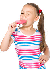 Image showing Little girl with lollipop