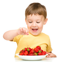 Image showing Little boy with strawberries