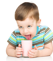 Image showing Cute little boy with a glass of milk