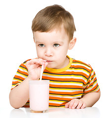 Image showing Cute little boy with a glass of milk